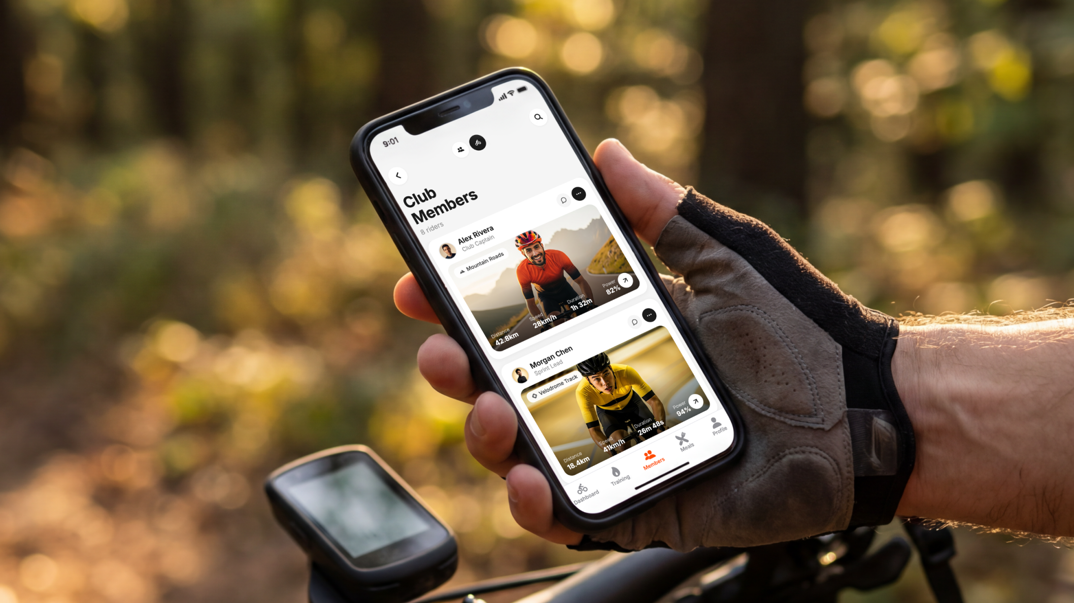 Cyclist's hand holding their phone, displaying a mobile app for cyclers.